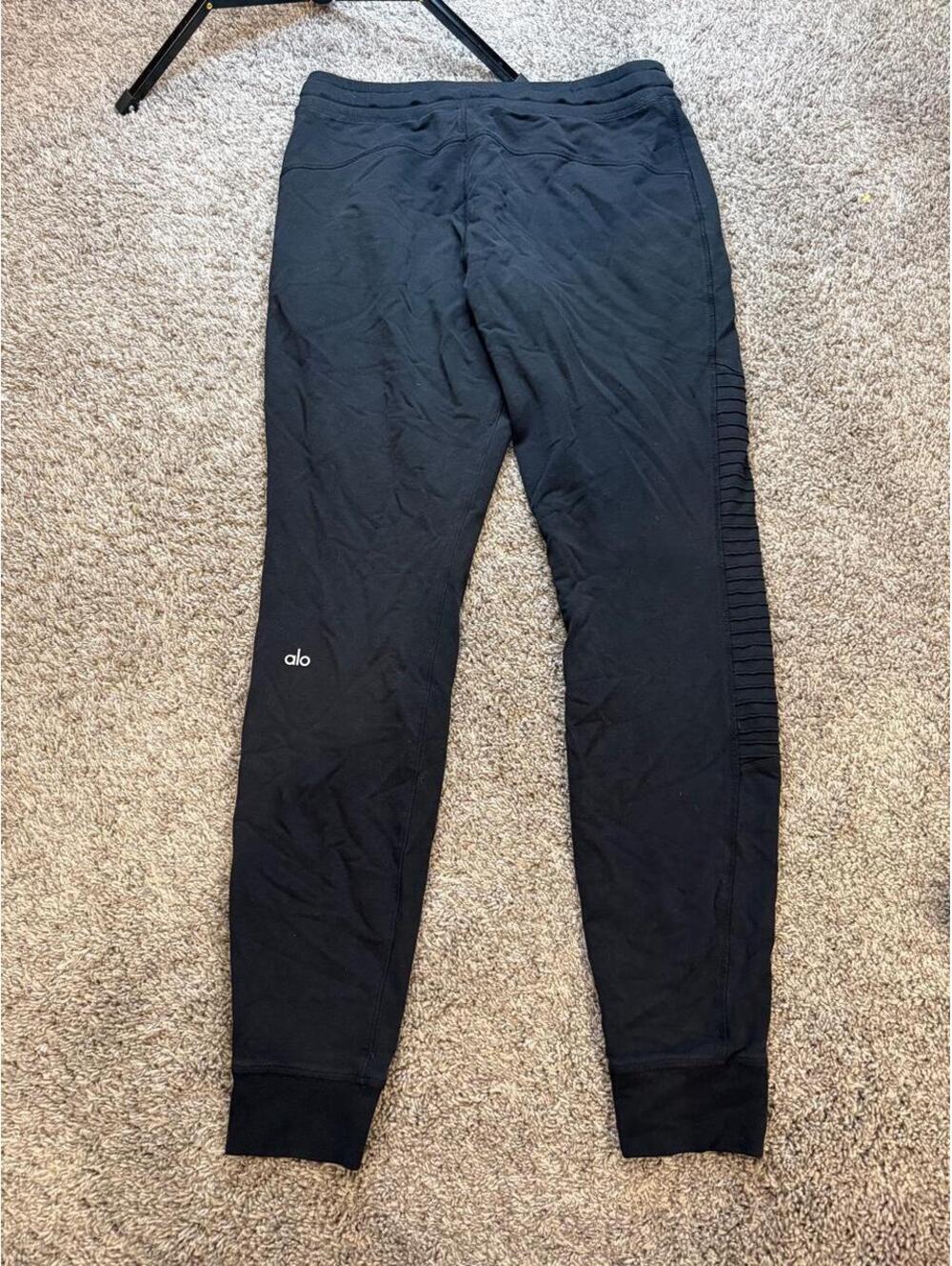 Alo Black Jogger Sweatpants with Ribbed Detailing and Zip Pockets